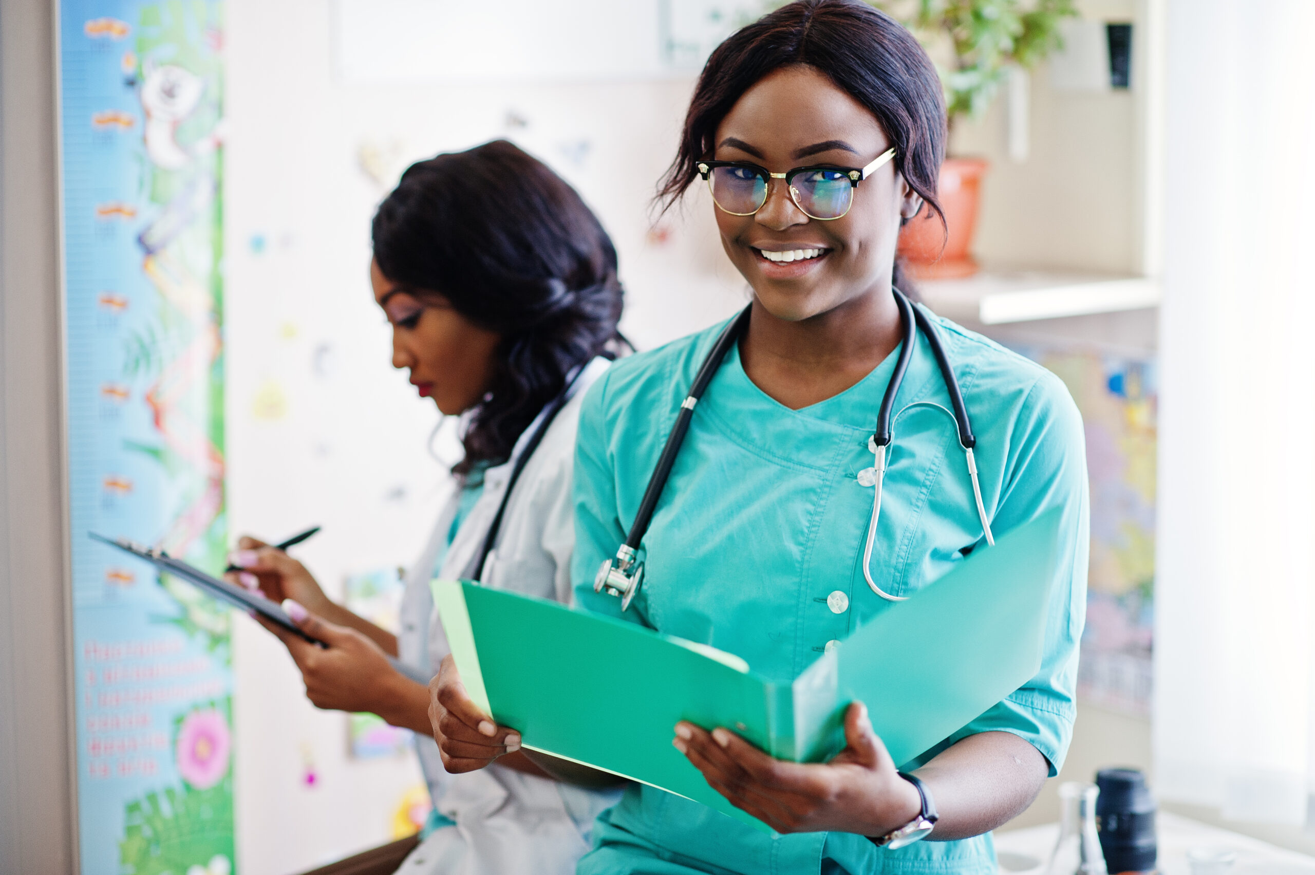Two african american pharmacist working in drugstore at hospital